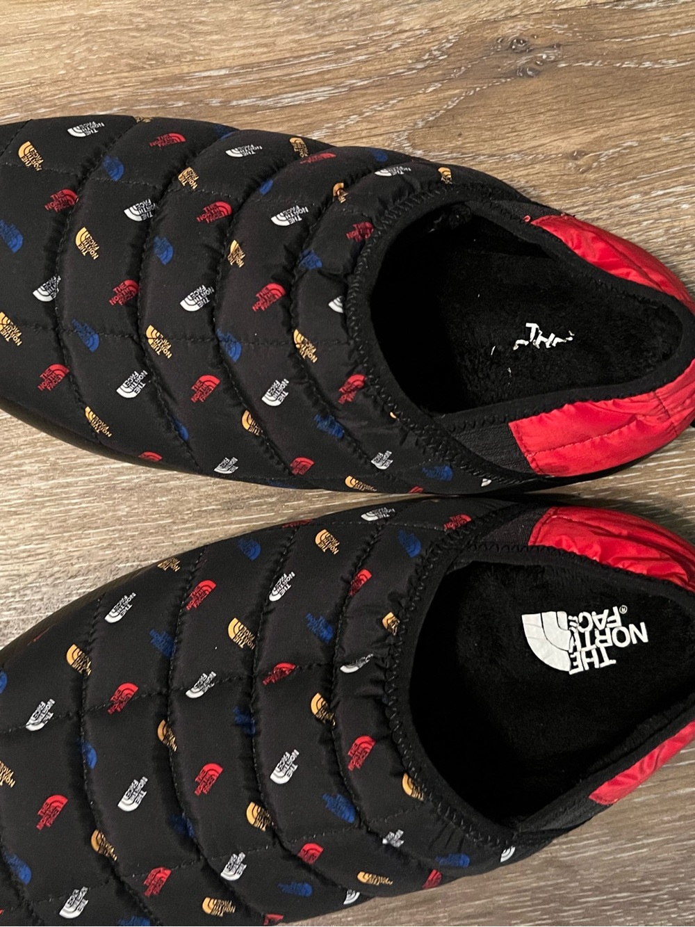 The North Face Men’s Black Quilted Slip-On Slippers with Multi-Color Logo